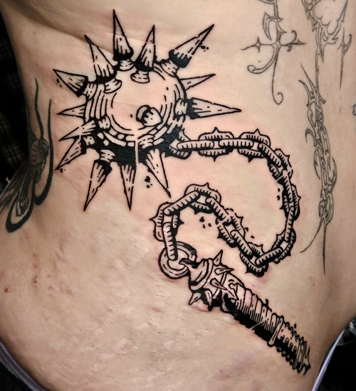 Bold blackwork mace tattoo